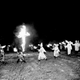 File photo of Ku Klux Klansmen carry torches and march around a large burning cross at a KKK rally in Spartanburg, S.C., Saturday, Aug. 17, 1963. (AP Photo)